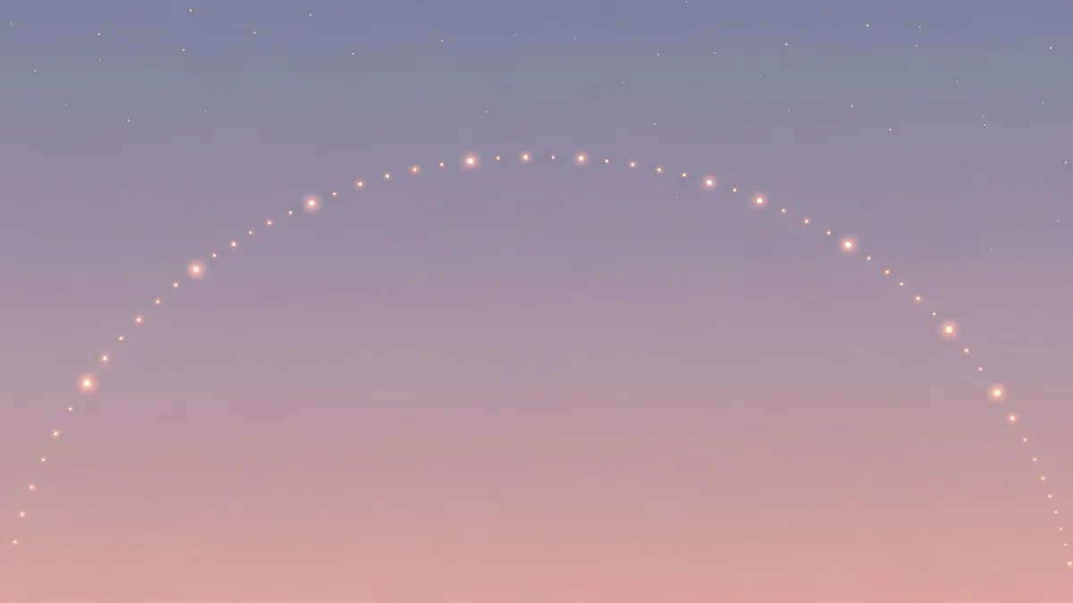淡い夜空の下、ゆるやかな弧をえがいて並ぶ小さな光の点の連なり
